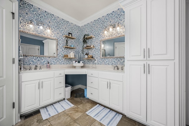 bathroom with ornamental molding and vanity