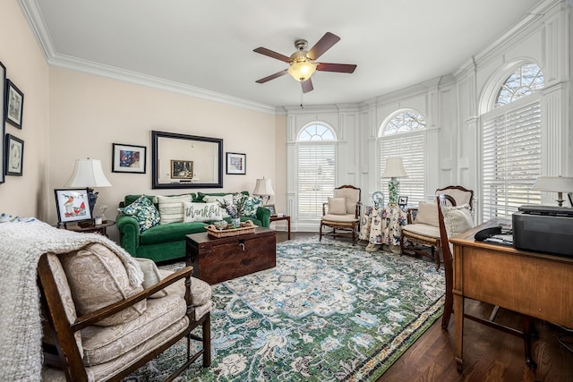 living room with crown molding, ceiling fan, and dark hardwood / wood-style floors