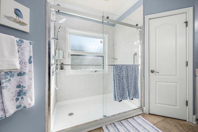 bathroom featuring a shower with shower door and tile patterned floors