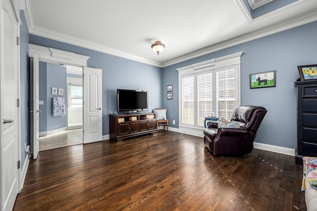 living area featuring ornamental molding and dark hardwood / wood-style flooring