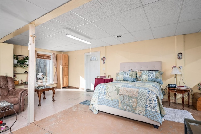 bedroom with a drop ceiling