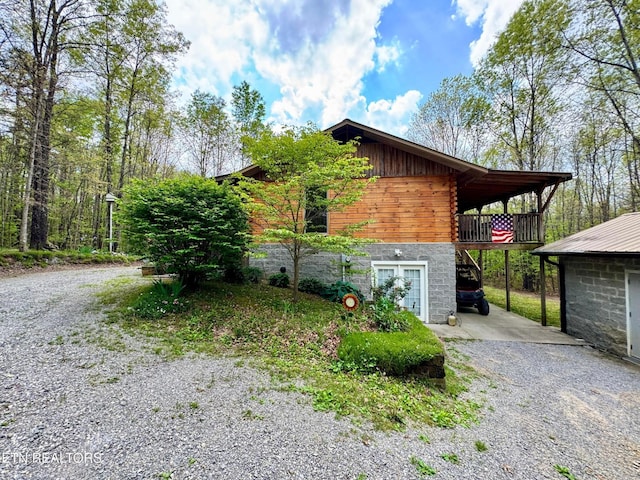 907 Parkstown Ext, Wilder, TN 38589 - view of side of home with driveway and stone siding
