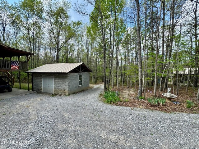 907 Parkstown Ext, Wilder, TN 38589 - garage featuring gravel driveway