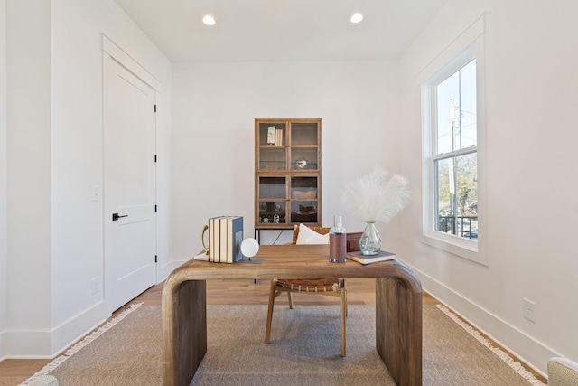 office area with hardwood / wood-style floors