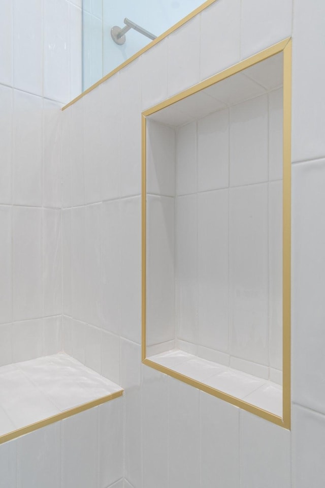 bathroom with a tile shower