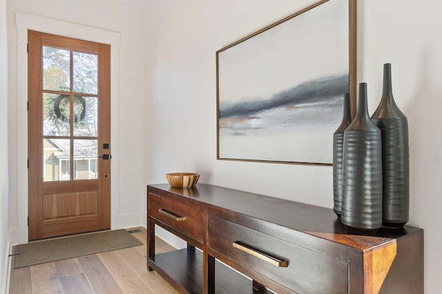 doorway to outside with light hardwood / wood-style floors