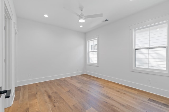 empty room featuring ceiling fan and light wood-type flooring