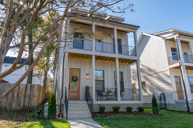 view of front of property with a balcony