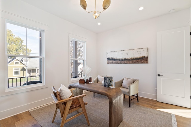 home office with hardwood / wood-style flooring