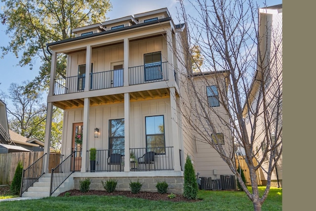 view of front of house with cooling unit, a balcony, and covered porch