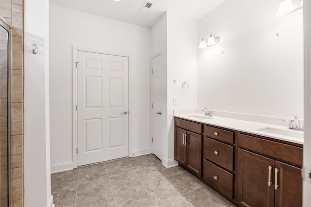 bathroom with vanity and walk in shower