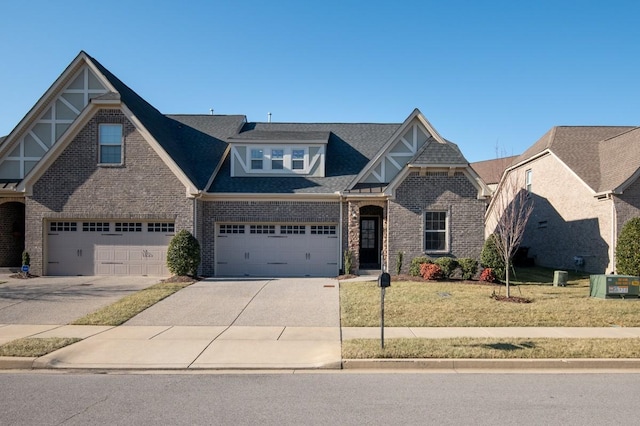 view of front facade featuring a garage and a front lawn