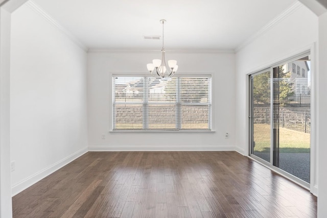 unfurnished dining area with dark hardwood / wood-style flooring, ornamental molding, a healthy amount of sunlight, and an inviting chandelier