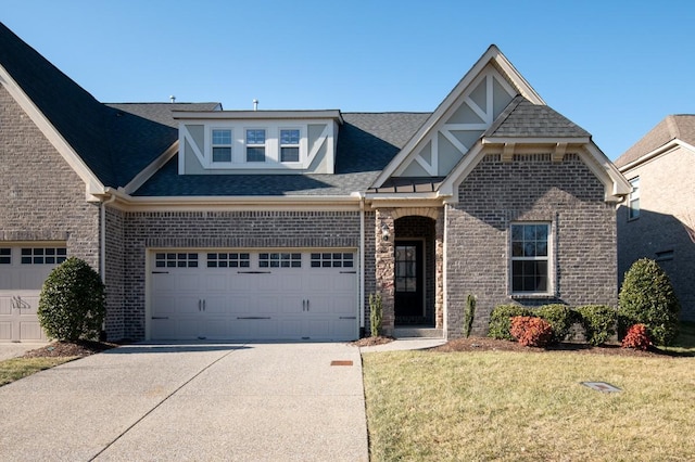 view of front of property with a garage and a front yard