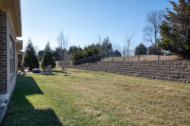 view of yard with a fire pit