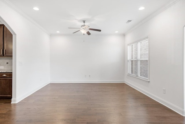 spare room with ceiling fan, ornamental molding, and hardwood / wood-style floors