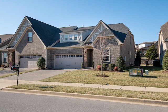 view of front of home featuring a garage and a front lawn