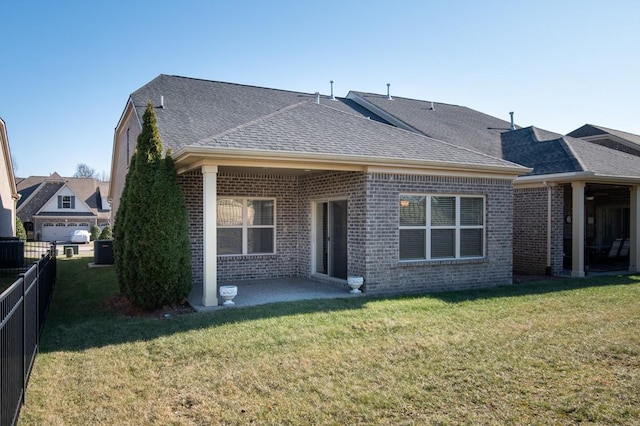 back of house with a yard, cooling unit, and a patio area