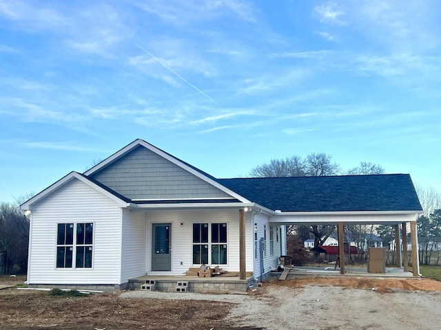 view of front of home featuring a porch and a shingled roof