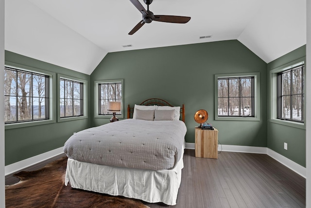 bedroom featuring ceiling fan, lofted ceiling, and dark hardwood / wood-style flooring