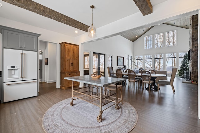 dining space featuring beamed ceiling, high vaulted ceiling, hardwood / wood-style floors, and french doors