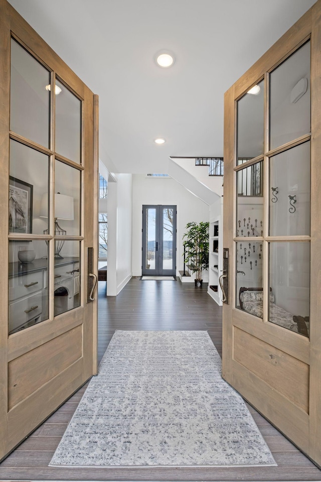 entrance foyer featuring hardwood / wood-style flooring and french doors