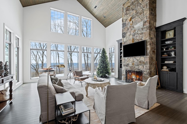 living room with wood-type flooring, high vaulted ceiling, wooden ceiling, and a fireplace