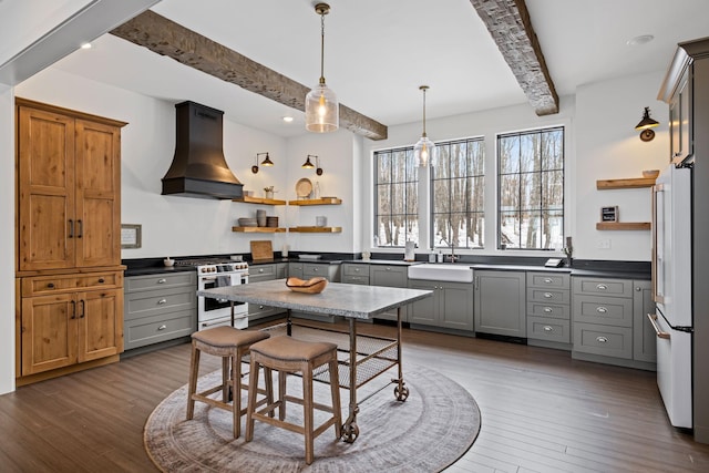 kitchen with premium range hood, sink, gray cabinetry, hanging light fixtures, and white appliances