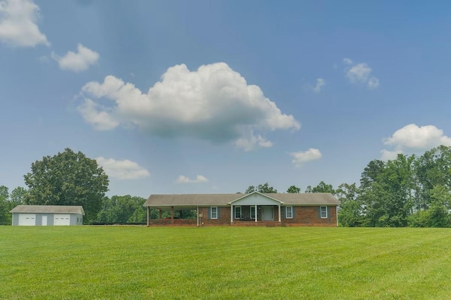 view of front of property featuring a garage and a front lawn