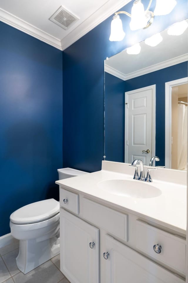 bathroom with crown molding, tile patterned floors, toilet, and vanity