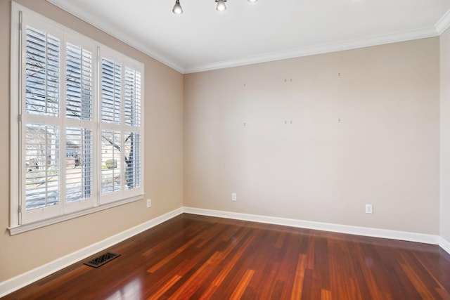 unfurnished room featuring crown molding and dark hardwood / wood-style flooring