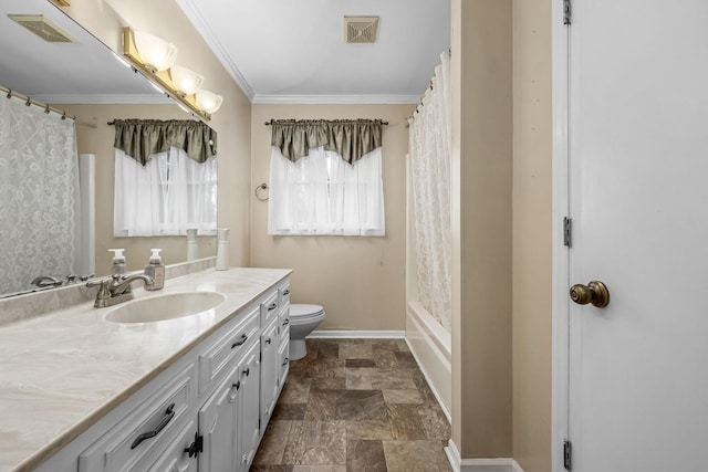 bathroom featuring vanity, crown molding, and toilet