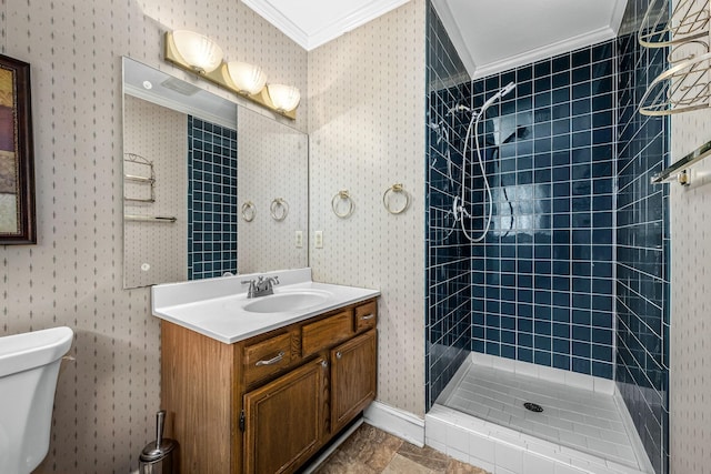 bathroom featuring crown molding, a tile shower, vanity, and toilet