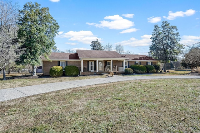 single story home with a front yard and a porch