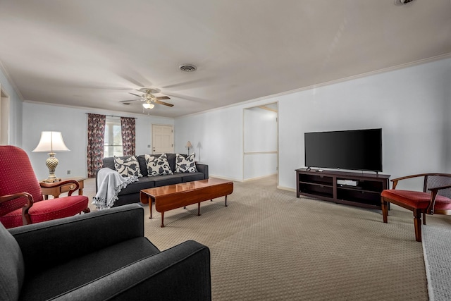 living room with ceiling fan, light colored carpet, and ornamental molding