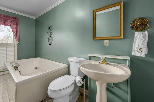 bathroom with ornamental molding, toilet, and a bathtub