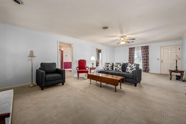 living room featuring ornamental molding, light colored carpet, and ceiling fan