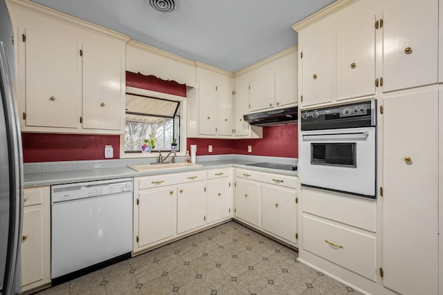 kitchen featuring sink and white appliances