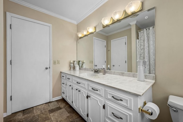 bathroom featuring vanity, crown molding, and toilet