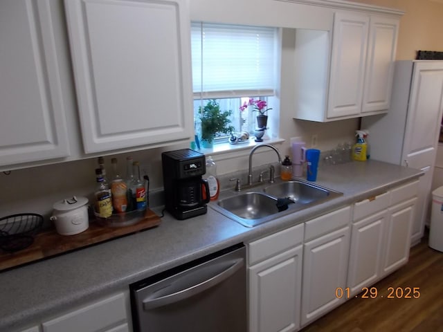 kitchen featuring white cabinetry, dark hardwood / wood-style flooring, dishwasher, and sink