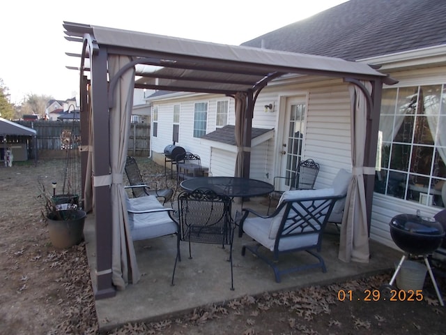 view of patio / terrace with area for grilling and a pergola