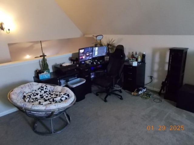 carpeted home office featuring vaulted ceiling