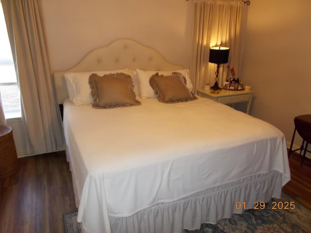 bedroom featuring dark wood-type flooring