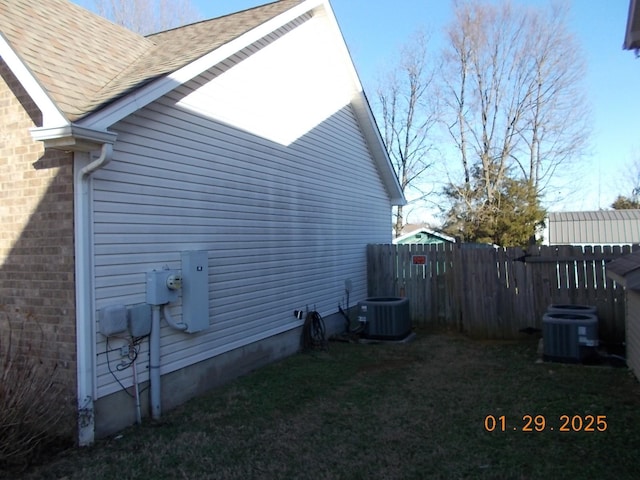 view of side of property with central AC