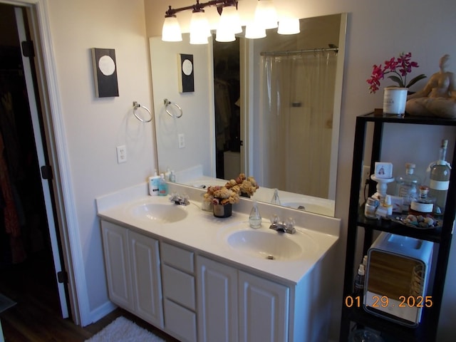 bathroom with vanity and walk in shower