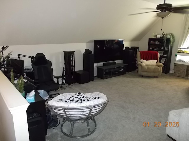 living room with lofted ceiling, ceiling fan, and carpet