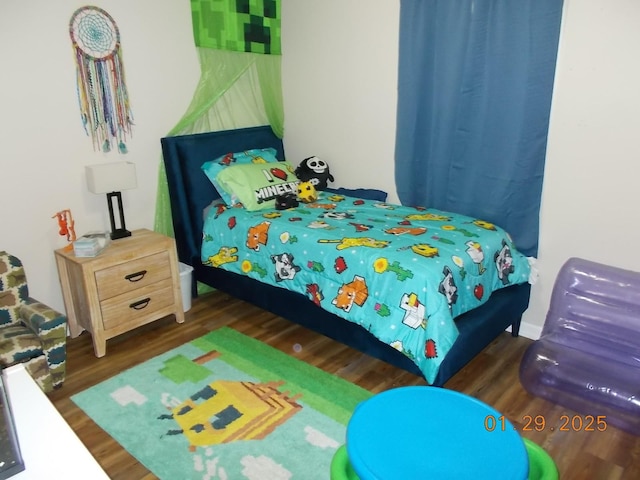 bedroom featuring dark wood-type flooring