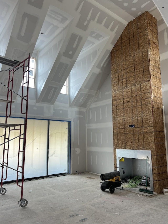 additional living space featuring a towering ceiling