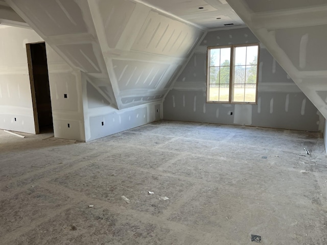 additional living space with vaulted ceiling