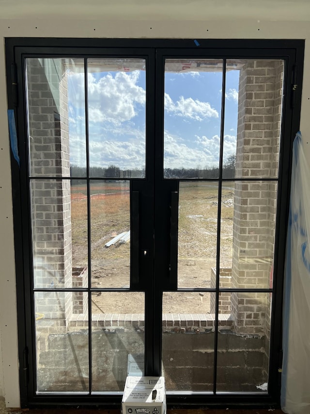 doorway to outside featuring a rural view